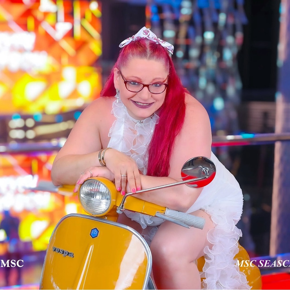 Meet your posher, Angie on a Yellow Vespa Scooter